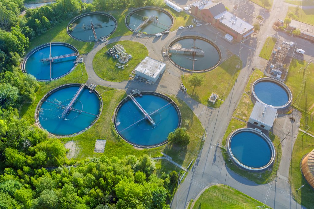 Aerial panoramic view of modern urban wastewater treatment plant.